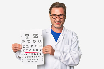 Experienced optometrist conducts eye exam with care, holding visual acuity test and prescription...