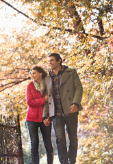 Fototapeta premium Couple walking together in park