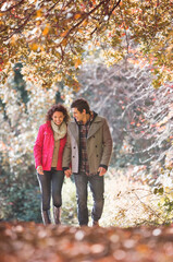 Couple walking together in park