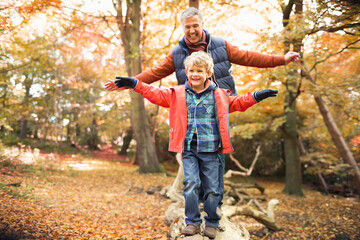 Man and grandson playing in park