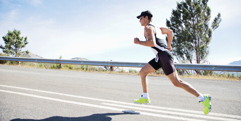 Fototapeta premium Runner in race on rural road