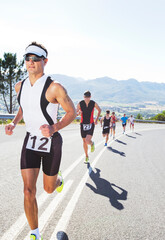 Runners in race on rural road