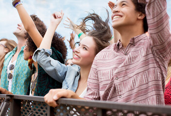 Fans cheering at music festival