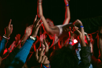 Fototapeta na wymiar Man crowd surfing at music festival