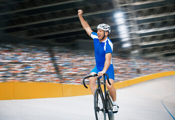 Obraz premium Track cyclist celebrating in velodrome
