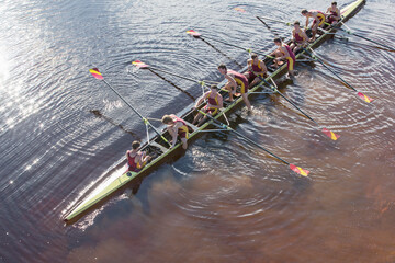 Rowing team in scull on lake