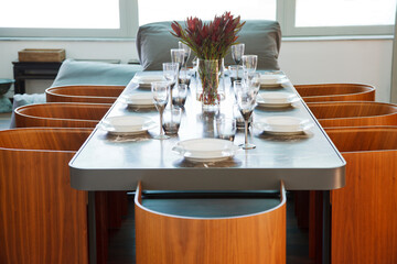 Place settings on table in luxury dining room