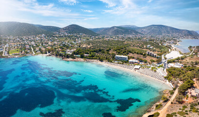 Aerial view of the beautiful bay of Avlaki at Porto Rafti, Attica, Greece, with turquoise sea and sand beaches