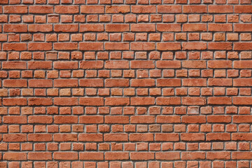 Old red brick wall background, wide panorama. Masonry wall, stonework