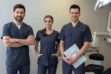 Team of dentists posing in dentistry