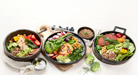 Healthy vegetarian and vegan  salads and Buddha Bowls with vitamins, antioxidants, protein on light  background.