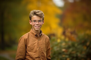 Medium shot portrait photography of a glad mature boy wearing a casual short-sleeve shirt against an autumn foliage background. With generative AI technology