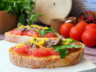 Bruschetta with grated tomatoes and anchovies. Spanish appetizer, tapas