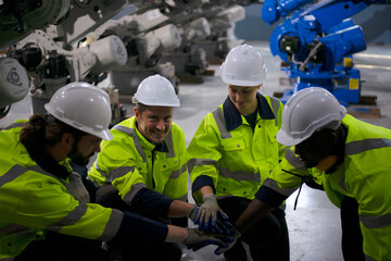 Engineer work at robotic arm factory.