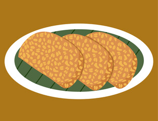 Fried tempeh served on a white plate is Indonesia traditional food. 