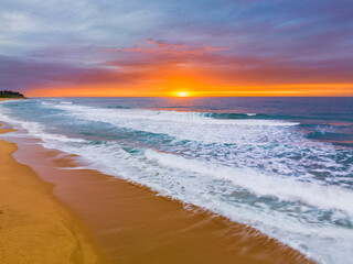 Aerial sunrise at the seaside with cloud cover