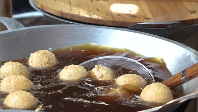 The big elephant meatballs are again fried in a large frying pan
