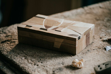 Small wooden jewellery box on carpentry table