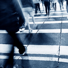Busy people on zebra crossing street in Hong Kong