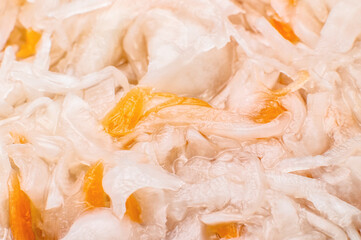 Sauerkraut with carrots, close-up. Sauerkraut with carrot background. Full frame texture. Flat lay. View from above