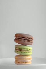 Multicolored macaroons. Two halves. Delicate French cookies. Coffee dessert. Cookies based on meringue. Crunchy crust. Colorful macaroon cookies in an appetizing still life.