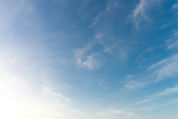 Beautiful blue and yellow sky with strange shape of clouds in the morning or evening taken at the sea