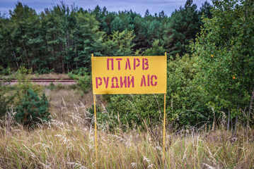 Red Forest warning sign in Chernobyl Exclusion Zone in Ukraine