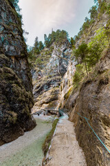 Fototapeta na wymiar Hiking trail to the impressive Almbach Gorge in the Berchtesgaden Land
