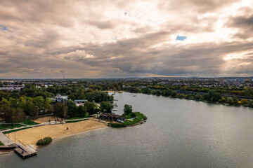 Aerial view - Bagry Lagoon, Podgórze XIII, Kraków, Poland - swimming spot in a city centre (kayak, sailing, sunbathing) Cracow must visit, sunset