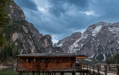 Boathouse of Lake Prags surrounded by the Italian Dolomites