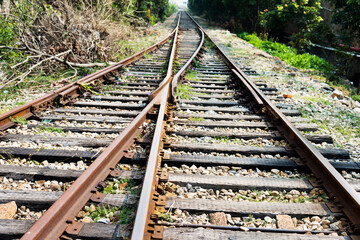 Fototapeta premium Two railway tracks merge together
