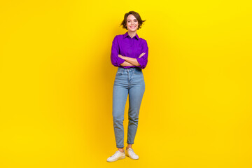 Full body photo of attractive young woman folded arms smile dressed stylish purple smart casual clothes isolated on yellow color background