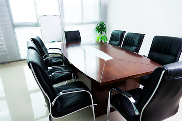 Empty conference room with table and chairs