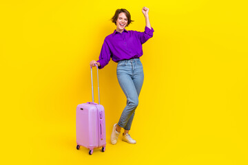 Full length photo of lucky funky woman dressed purple shirt finally doing new vacation isolated yellow color background
