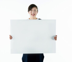 Beautiful asian woman holding a blank board isolated on white background