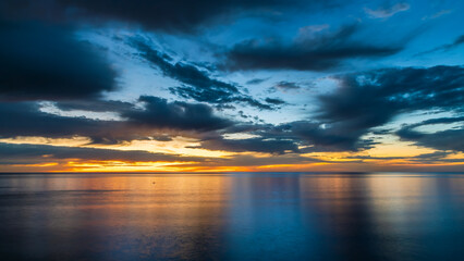 Fototapeta na wymiar Dramatic sunset with clouds viewed from Hallett Cove coastal trail, South Australia