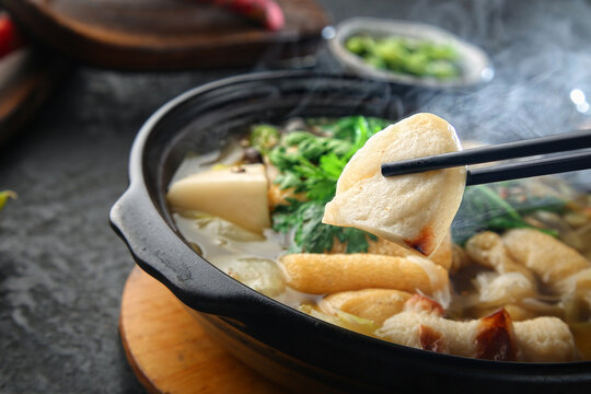 There's a crown daisy on top and it's boiling fish cake soup