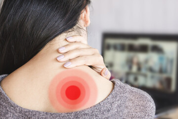 Woman Experiencing Shoulder Blade Pain from Prolonged Computer Use, Overworked at the Desk