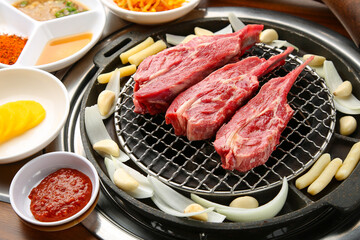 mutton being cooked over charcoal 숯불위에 익어가고 있는 양고기