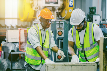 African black people worker working together asist new young employee teamwork in metal factory.