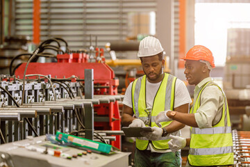 African black people worker working together asist new young employee teamwork in metal factory.