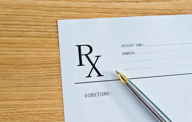 Medical prescription and pen on doctor desk