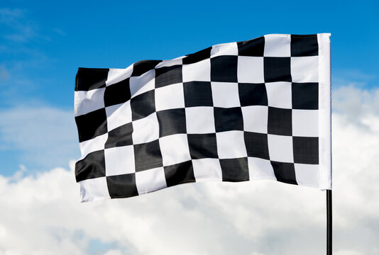 Checkered flag on blue sky