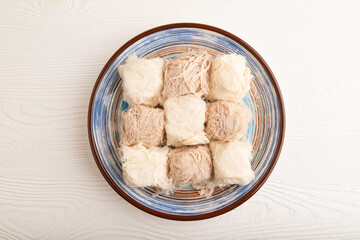 traditional arabic sweets pishmanie on white wooden, top view.