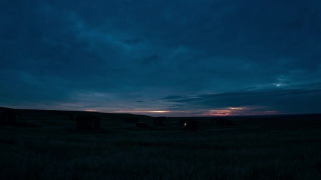 Time lapse sunrise over prairie rental cabins