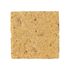 Square cookie cracker close-up. Carbohydrate snack. Isolated on white background.