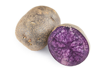 Two purple potatoes, one cut, the other whole. Isolated on white background.