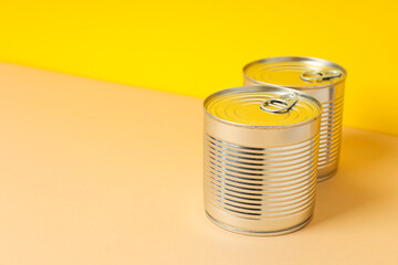 Canned food in blank metal jars, concept of canned food