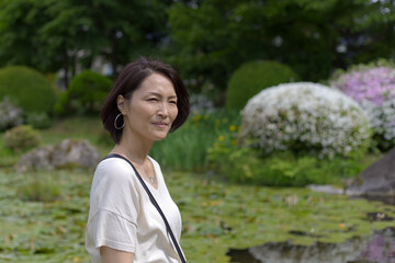 Japanese woman wearing hoop earings outdoors