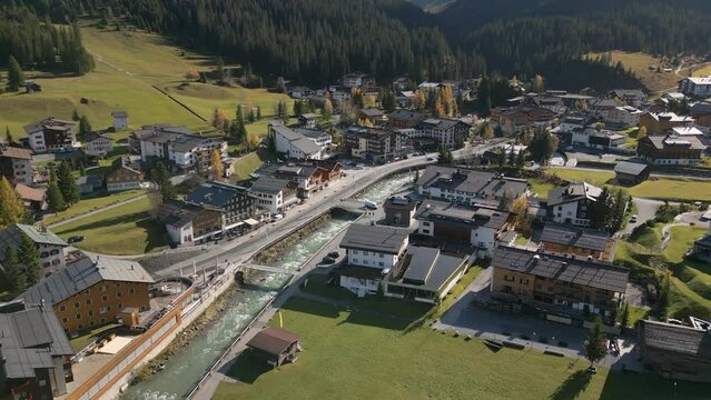 This aerial drone video shows the small village of Lech. Lech is a skiresort in Voralberg, western Austria. The town is located between the mountains of the Alps. 